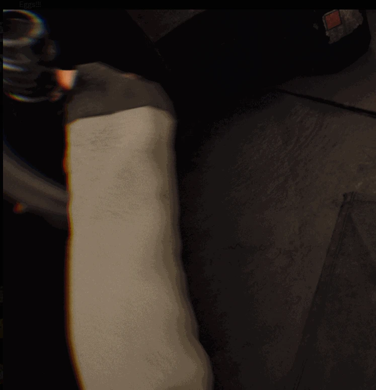 A first person view almost entirely filled by the player's own sleeved arm, twisted up in front of the camera by the broken hand IK