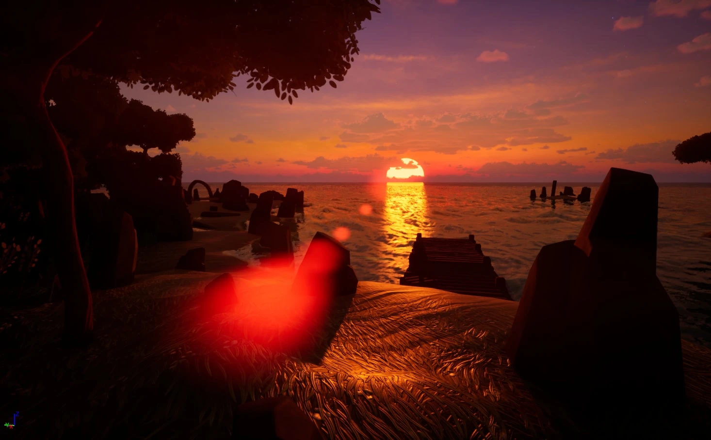 A jetty and ruined stones silhouetted against a red sunset over the sea, with a lens flare in the foreground
