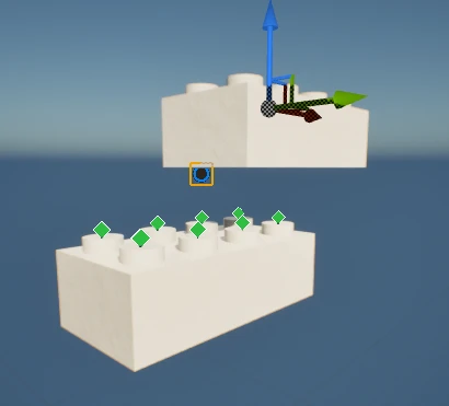 Two white bricks in Unreal. The upper one is selected with a move gizmo on one of its studs, and the lower one shows small green diamond markers on its top studs where the selected stud can attach